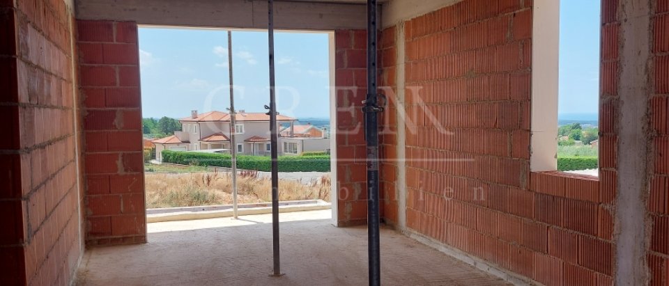 Semi-detached house under construction with a sea view